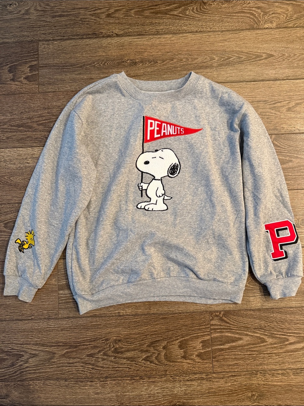 Peanuts Grey Crewneck Sweatshirt with Red Pennant and Yellow Woodstock Accent